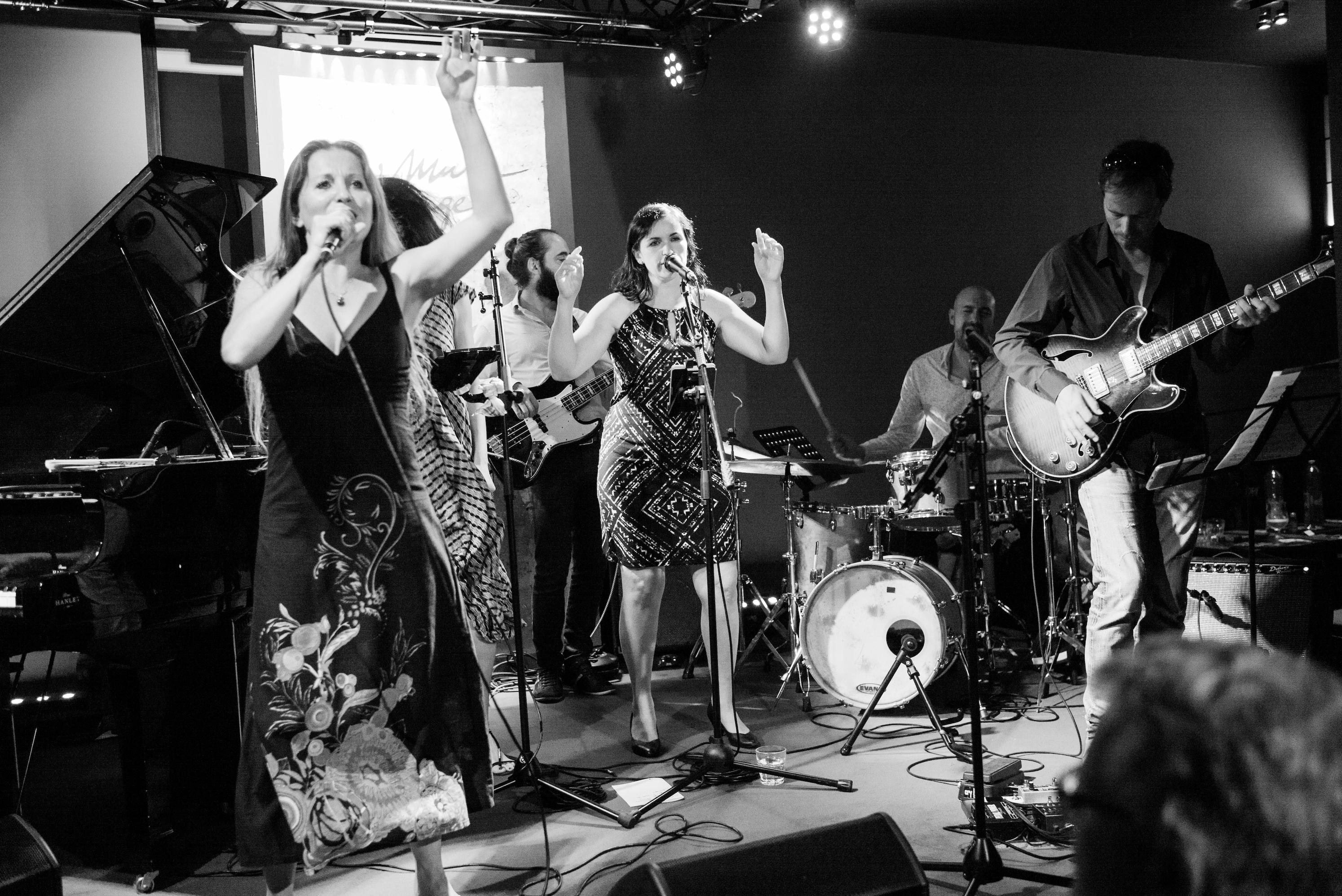 Three vocalists and band